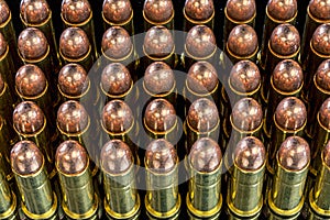 Many bullets for a pistol with copper tips