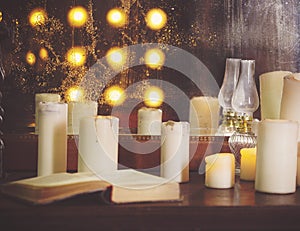 Many burning candles on a mirrored background