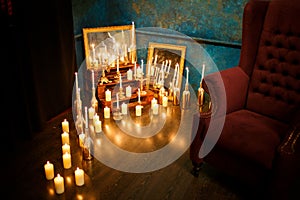 Many burning candles on a mirrored background