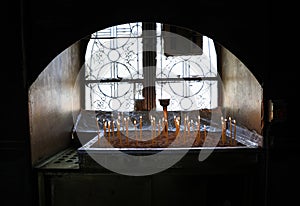 Many burning wax candles in the Saint George`s chapel, Mount Lycabettus, Athens, Greece.