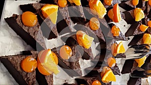 Many cakes with orange and chocolate