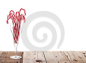 Many Candy canes in a wine glass