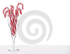 Many Candy canes in a wine glass