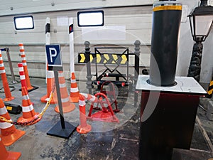 Many car traffic road signs and automatic barrier at hardware warehouse