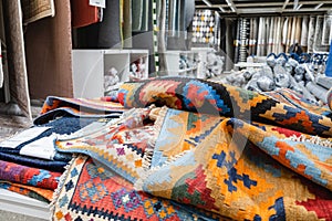 Many carpets, different colors, a great choice in the store
