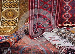 Many carpets of different quality on sale in the market
