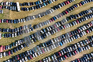 Many cars parked in the field. Car background