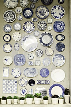 Many ceramic plates on the wall