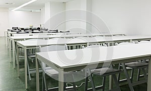 Picture of many chairs and tables in the presentations hall