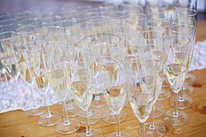 Many champagne glasses on the table