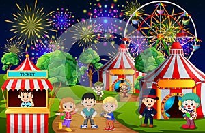 Many Children and people worker having fun in amusement park at night