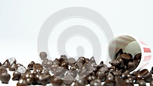 Many chocolate chips are on gray abstract background.