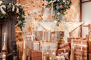 Many Christmas gifts. Winter home decor. Christmas in loft interior against brick wall.