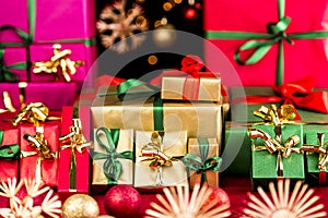 Many Christmas Presents Grouped by Color photo