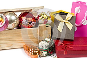 Many christmas tree toys with wooden box and gift boxes on white