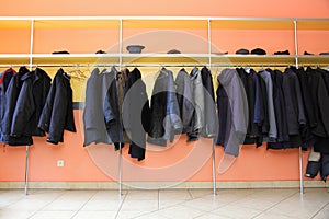 Many clothes in cloakroom photo