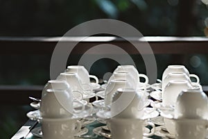 many coffee cup set up for tea break in business meeting