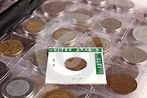 Many coins of different countries and times. Numismatics