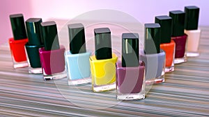 Many colored bottles set of nail polish, pastel colors varnish