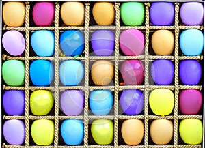 Many colorful air baloons in separate boxes