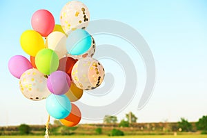 Many colorful balloons against blue sky