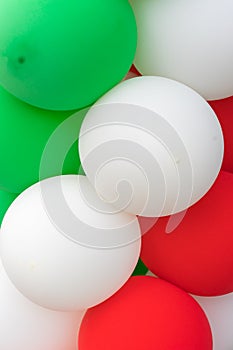 Many colorful balloons decorated wall as background.