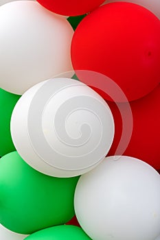 Many colorful balloons decorated wall as background.