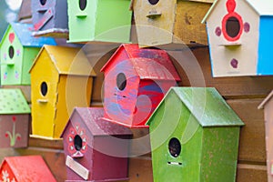 Many colorful birdhouses, wooden houses for birds as a symbol of wish fulfillment