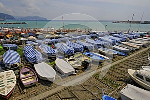 many colorful boats on the shore across the seaside view in Lavagna, Liguria, Italy. Coast view