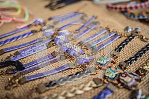 Many colorful bracelets from handcraft souvenirs shop