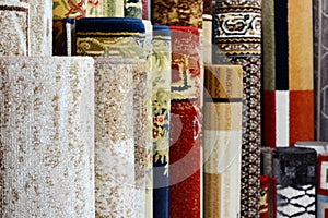 Many colorful carpets in the store. Carpet Rolls Shop Colourful Fabric decoration