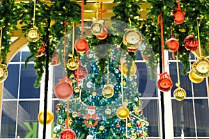 Many colorful christmas ball hang by ribbin with face christmas photo