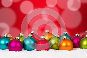 Many colorful Christmas balls background decoration with snow