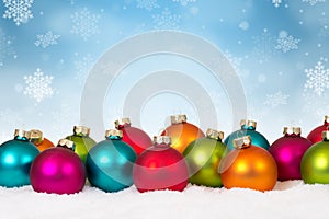 Many colorful Christmas balls baubles background decoration snow