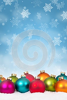 Many colorful Christmas balls baubles background decoration snow