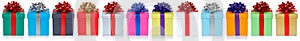 Many colorful christmas presents birthday gifts in a row banner isolated on a white background
