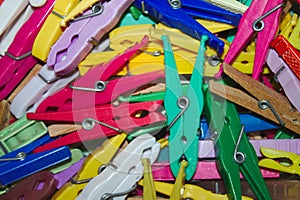 Many colorful clothespins bunched together