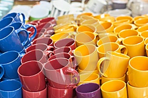 Many colorful empty ceramic cups