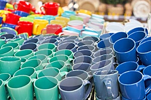 Many colorful empty ceramic cups