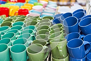 Many colorful empty ceramic cups