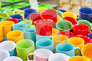 Many colorful empty ceramic cups