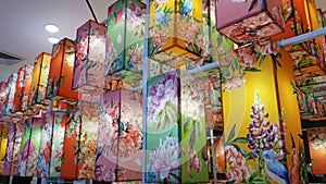 Many colorful fabric hanging lanterns.