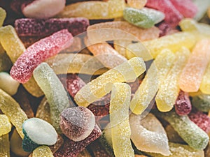 Many colorful jelly beans sweets background. Gumdrops candies with sugar crystallized