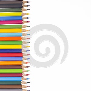 Many colorful pencils in a vertical row