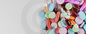 Many colorful pills, medicines. Pills supplements Background. Various pills and capsules as daily vitamins and supplements concept