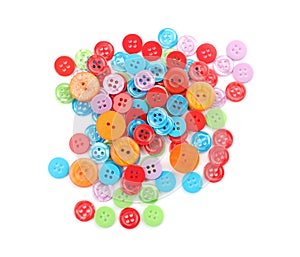 Many colorful plastic sewing buttons isolated, top view
