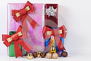 Many colorful presents with luxury ribbons on white background