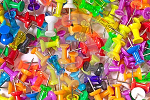 Many colorful push pins, isolated