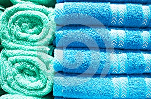 Many colorful towels is folding in shelfs at store for Sales