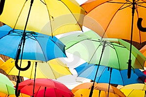 Many colorful umbrellas against the sky in city settings. Kosice, Slovakia